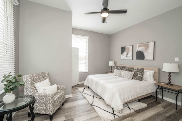 The 1st floor king suite offers a chic sitting area & private half en suite