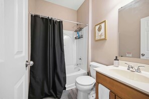 Shower, hair dryer, towels, shampoo