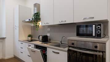 Comfort Apartment | Private kitchen | Fridge, microwave, oven, stovetop