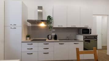 Comfort Apartment | Private kitchen | Fridge, microwave, oven, stovetop