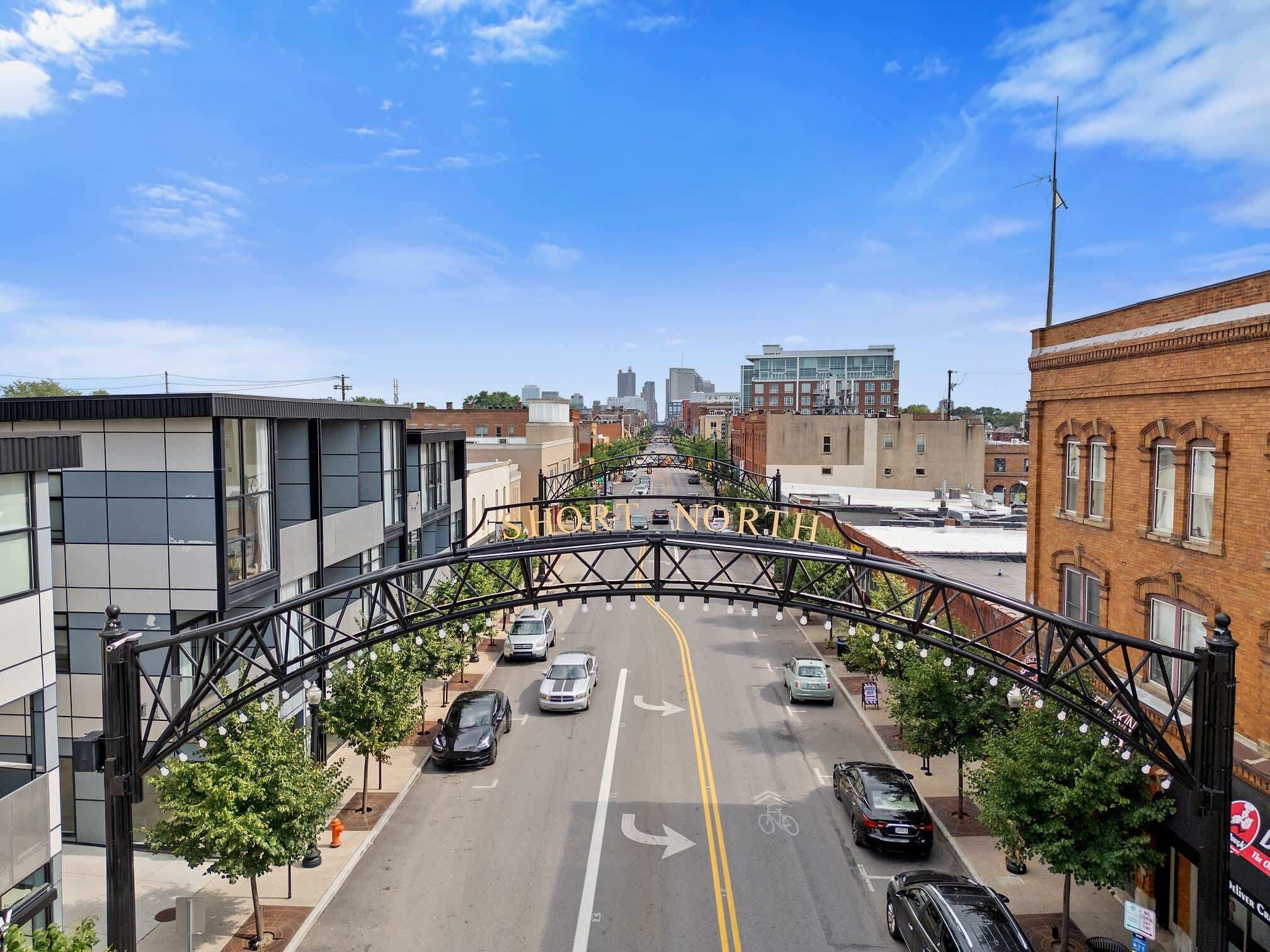 A street view with a bridge labeled "SHORT NORTH" and modern buildings.