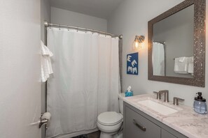 Shower, hair dryer, towels, shampoo
