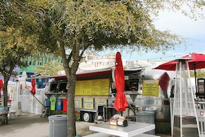 A food truck with a menu board, a ladder, and a red umbrella. - 🌴30A-Private Pool-Walk to Beach-Blue Fish Bungalow🌴 (Santa Rosa Beach)