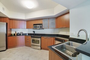 Coffee/tea maker, fridge, microwave, oven