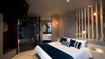 Suite junior, vistas a la montaña | 1 dormitorio, caja fuerte, cortinas opacas y wifi gratis