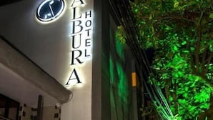 The exterior of the Alburra Hotel with a prominent illuminated sign. - ALBURA HOTEL (Pereira)