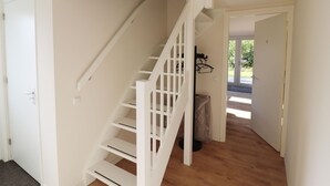 A staircase leading to a second floor in a residential setting. - Chalet in Friesland Near Large Lakes (Sint Nicolaasga)