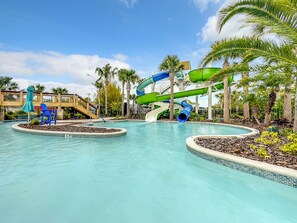 A water park with multiple slides and a pool area.