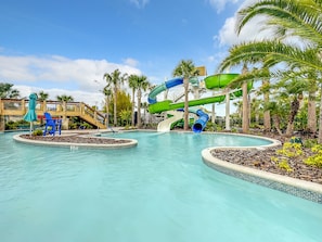 A water park with multiple slides and a pool area. - Windsor Island Vacation Pool Home (Davenport)