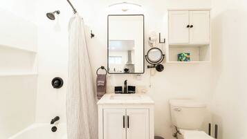 Hair dryer, towels, soap, shampoo