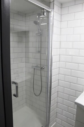 Shower, hair dryer, towels, soap