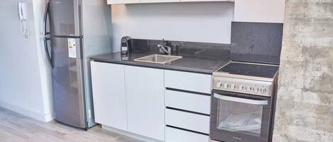 Microwave, oven, coffee/tea maker, cookware/dishes/utensils