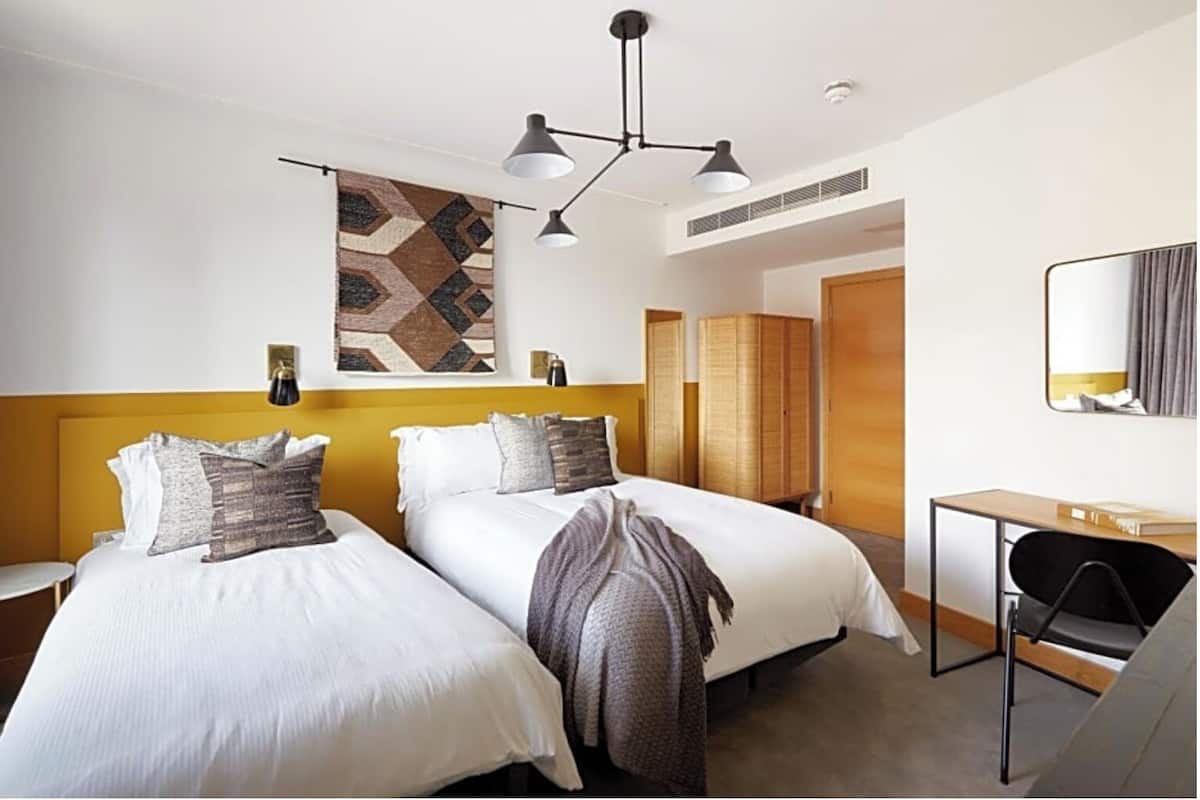 Family Triple Room, City View | In-room safe, laptop workspace, iron/ironing board, free WiFi