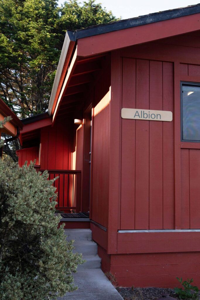 A red building with a sign reading "Albion."