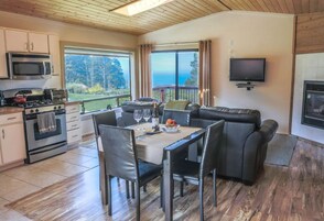Deluxe Cottage, Ocean View | Living area | 32-inch Smart TV with digital channels, streaming services