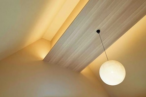 A ceiling with a wooden panel and a spherical light fixture. - Reikyo Garden Osaka (Osaka)
