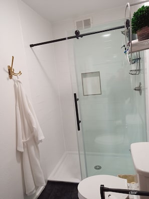 Shower, hair dryer, towels, soap