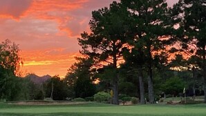A golf course with a clear sky and trees in the background. - Overlooking Amazing Pool, 2 King ensuite Condo, location, location, location! (Sedona)