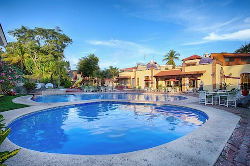 2 outdoor pools, open 9:00 AM to 9:00 PM, pool umbrellas, sun loungers