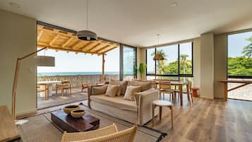 Exclusive Apartment, Balcony, Ocean View | Living area | 35-inch flat-screen TV with digital channels