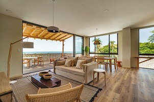 Exclusive Apartment, Balcony, Ocean View | Living area | 35-inch flat-screen TV with digital channels