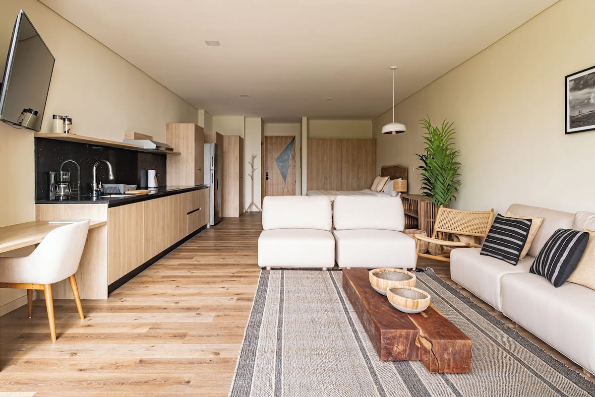 Luxury Studio Suite, Beach View | Living area | 35-inch flat-screen TV with digital channels