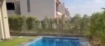 4-bedroom villa in the crown palm hills compound-sheikh zayed with private pool