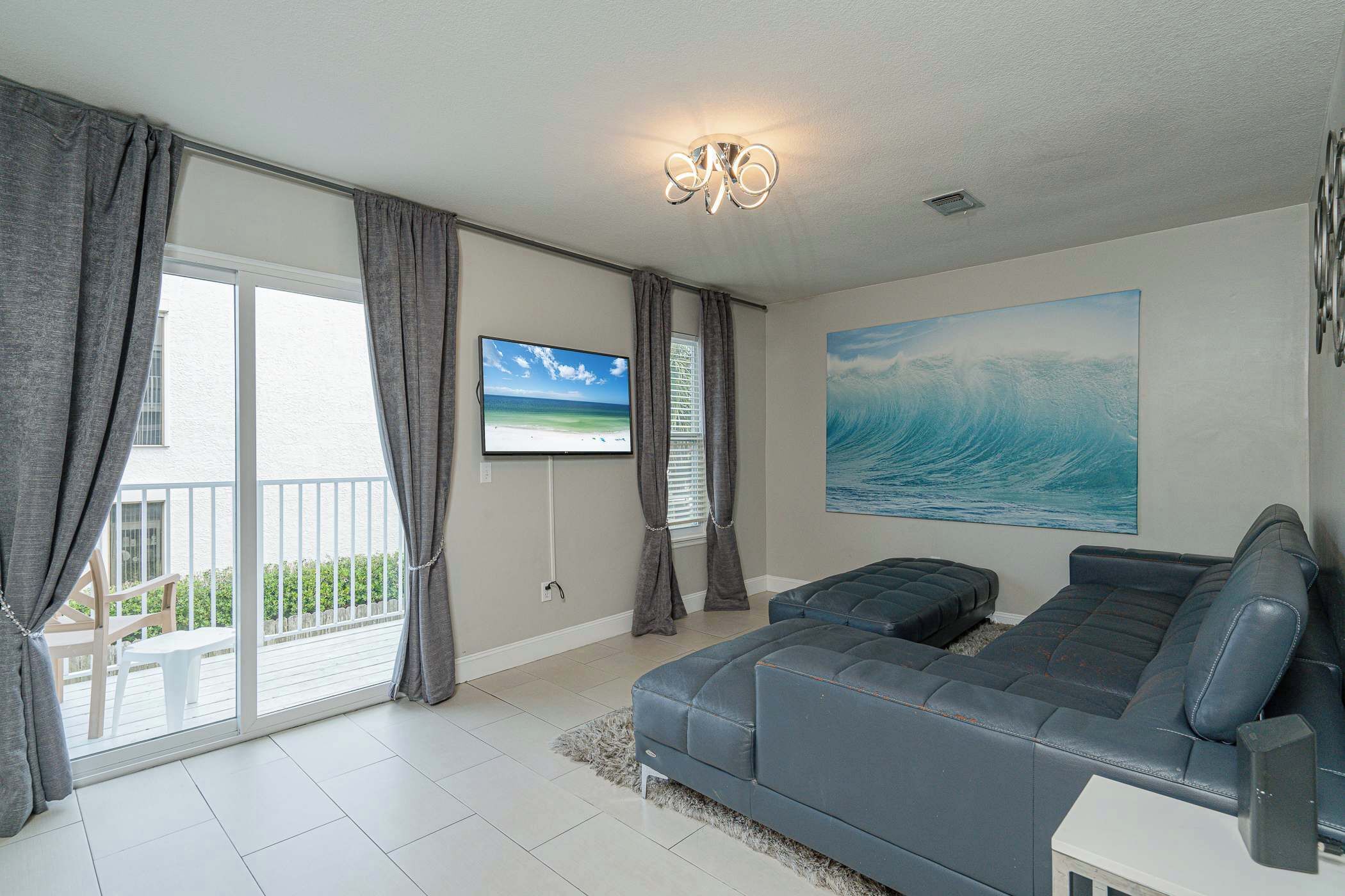 Curl up in the coastal living room & stream all your favorite entertainment