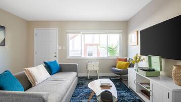 Apartment, 1 Bedroom | Living area | 55-inch Smart TV with digital channels