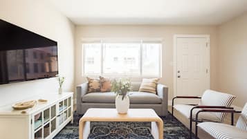 Apartment, 1 Bedroom | Living area | 55-inch Smart TV with digital channels