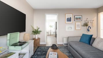 Apartment, 1 Bedroom | Living area | 55-inch Smart TV with digital channels