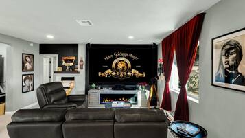 Smart TV, fireplace, books, stereo