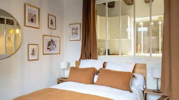 2 habitaciones, tabla de planchar con plancha y ropa de cama