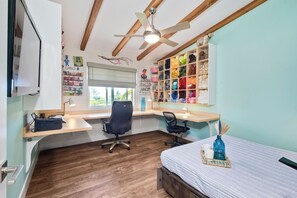 The final bedroom is a crafter’s dream, with a queen Murphy bed & Smart TV