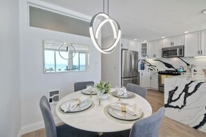 Gather for elegant meals together at the dining table, with seating for 4 - Solana Sunset – Stunning Beachside Retreat for 4! (Solana Beach)