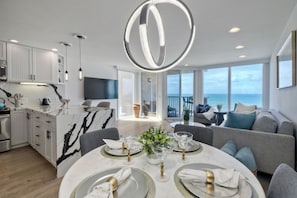 Gather for elegant meals together at the dining table, with seating for 4 - Solana Sunset – Stunning Beachside Retreat for 4! (Solana Beach)