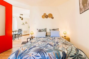 1 bedroom, desk, iron/ironing board, travel crib