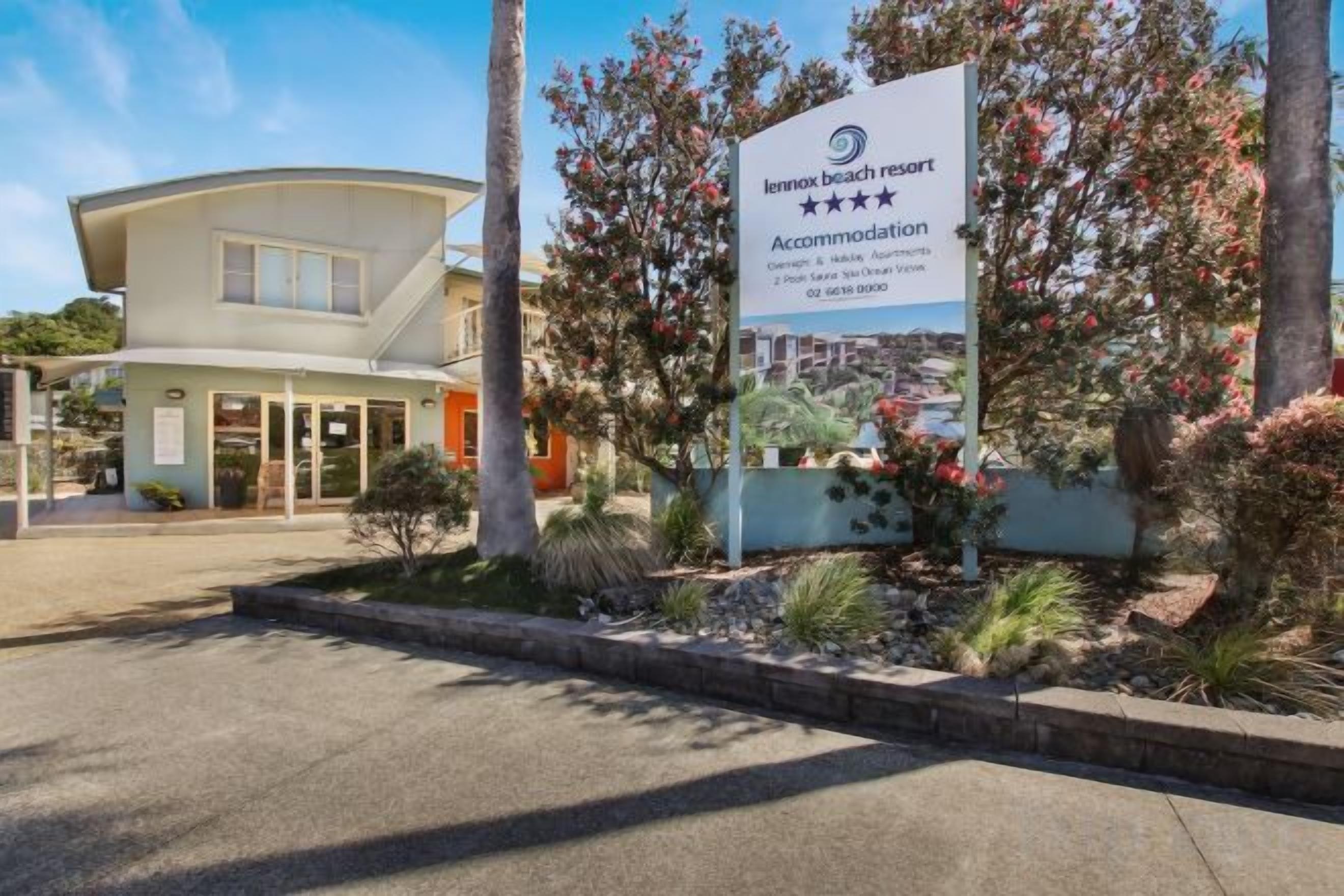 A building with a signboard indicating it is a beach resort accommodation.