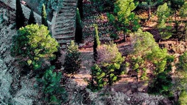 A large stone building with a courtyard, surrounded by trees and a swimming pool. - CAN PINÓS DE GUIMERÀ  (Guimerà)