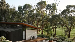 A modern house with a patio, surrounded by trees and a grassy field. - Ukiyo House “The Floating World” (Port Willunga)