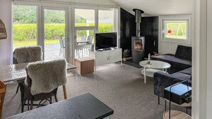 A furnished living room with a fireplace, television, and seating area. - Stunning home in Hemmet with sauna (Hemmet)