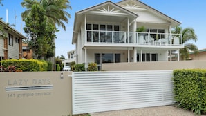 A two-story house with a balcony and a sign that reads "LAZY DAYS 141 gympie terrace". - Lazy Days by Stay Noosa (Noosaville)