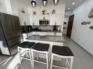 Fridge, microwave, stovetop, coffee/tea maker