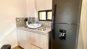 Cabin | Private kitchen | Fridge, cookware/dishes/utensils