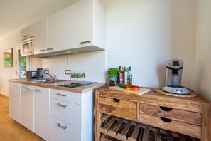 Fridge, microwave, stovetop, coffee/tea maker