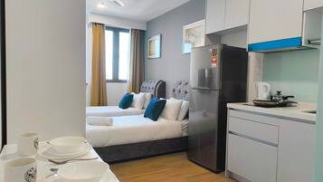 Estudio Grand, 2 camas individuales | Zona de estar