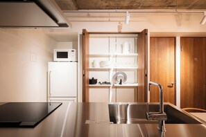 Fridge, microwave, cookware/dishes/utensils