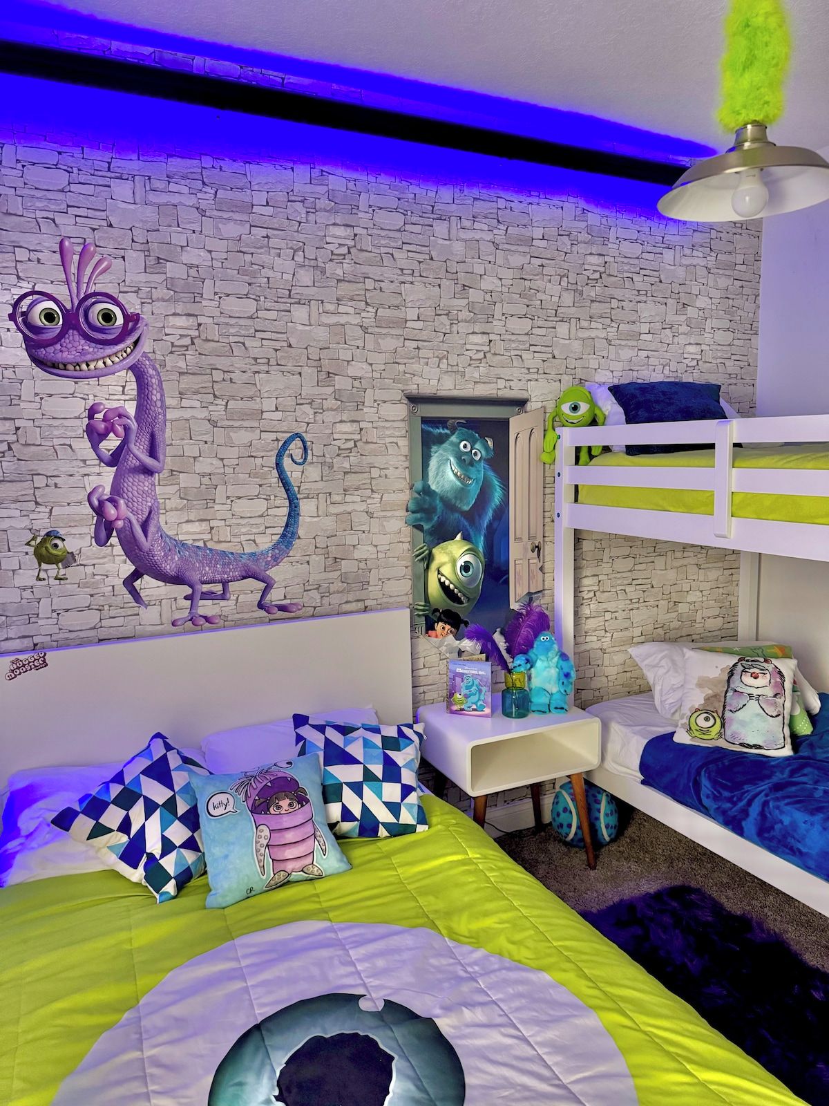 A child's bedroom with a brick wall, a ceiling fan, bunk beds, and various toys and decorations.