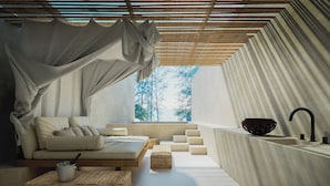 A modern, minimalist bedroom with a large window, a built-in bed, a bedside table, and a small bathroom with a sink and a decorative bowl. - Cafe del Mar Hotel (Kamala)