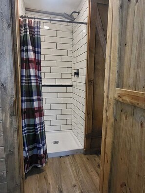 Shower, towels, soap, toilet paper